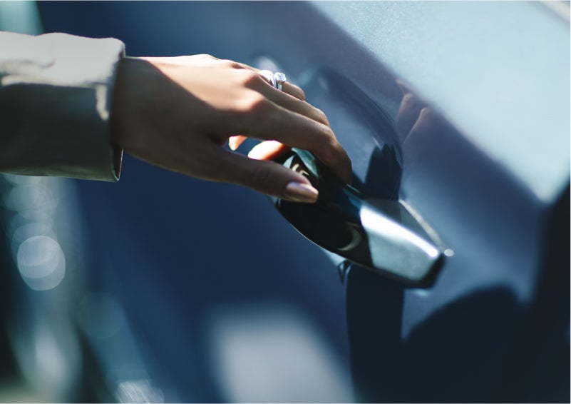 A hand gracefully grips the Light Touch Handle of a 2023 Lincoln Aviator® SUV to demonstrate its ease of use | Al Packer Lincoln in West Palm Beach FL