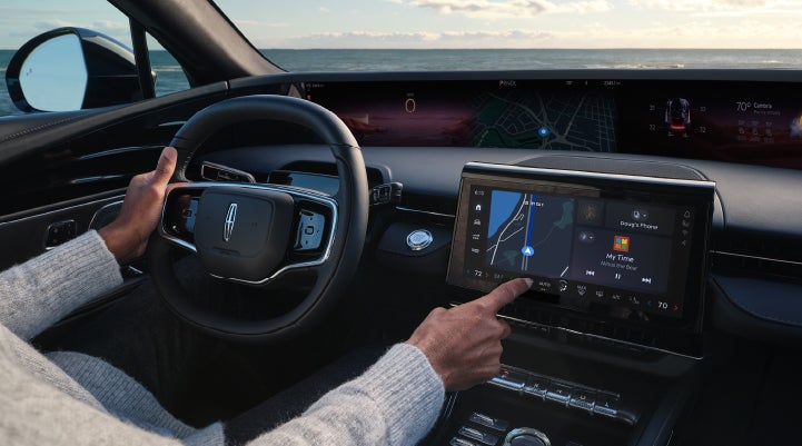 The driver of a 2024 Lincoln Nautilus® SUV interacts with the new Lincoln Digital Experience. | Al Packer Lincoln in West Palm Beach FL