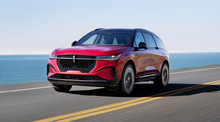 A 2024 Lincoln Nautilus® SUV is being driven on a seaside roadway. | Al Packer Lincoln in West Palm Beach FL