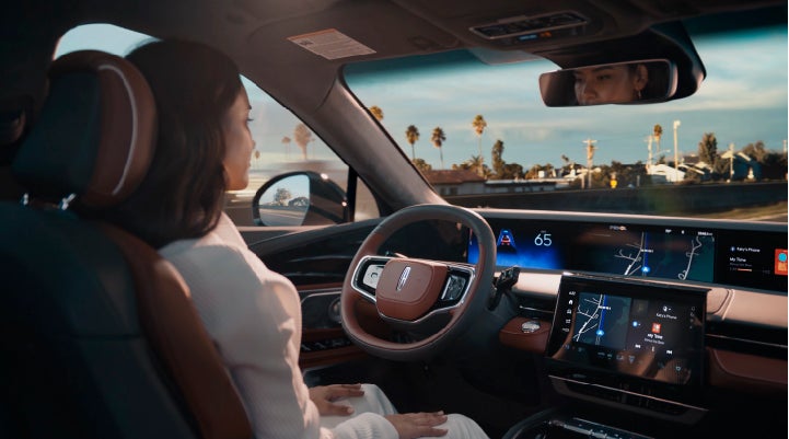 A person is shown driving hands-free on the highway with available Lincoln BlueCruise technology. | Al Packer Lincoln in West Palm Beach FL