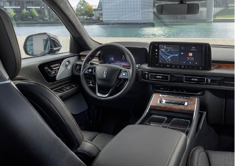 The interior of the 2026 Lincoln Aviator® SUV is shown parked with a view of a harbor through the windshield. | Al Packer Lincoln in West Palm Beach FL