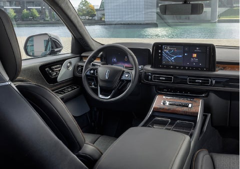 The interior of the 2026 Lincoln Aviator® SUV is shown parked with a view of a harbor through the windshield. | Al Packer Lincoln in West Palm Beach FL