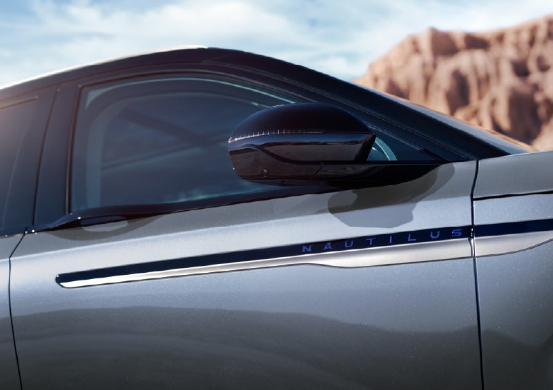 Blue lettering on the side of the vehicle that reads Nautilus indicates the available Hybrid Powertrain. | Al Packer Lincoln in West Palm Beach FL