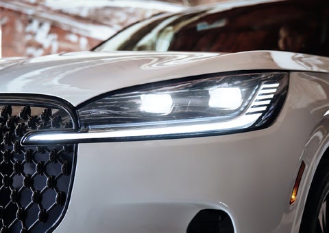A close-up of a headlamp on the 2027 Lincoln Aviator® SUV is shown. | Al Packer Lincoln in West Palm Beach FL