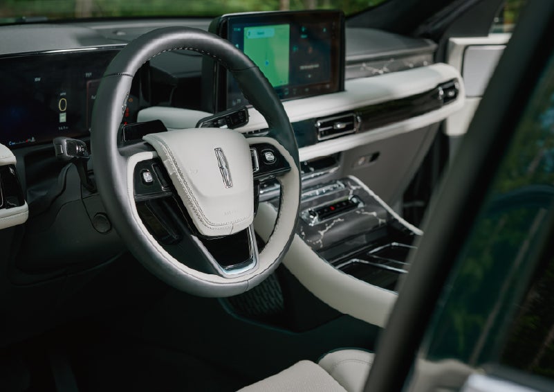 The leather-trimmed steering wheel of a 2027 Lincoln Aviator® Black Label™ SUV. | Al Packer Lincoln in West Palm Beach FL