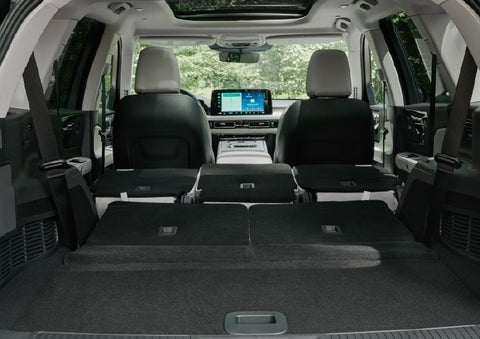 A rear to front view of the interior of a 2027 Lincoln Aviator® Black Label™ SUV shows the third and second rows folded flat | Al Packer Lincoln in West Palm Beach FL
