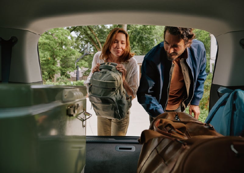 A couple loads luggage into the rear of a 2027 Lincoln Aviator® Black Label™ SUV..e 202 | Al Packer Lincoln in West Palm Beach FL