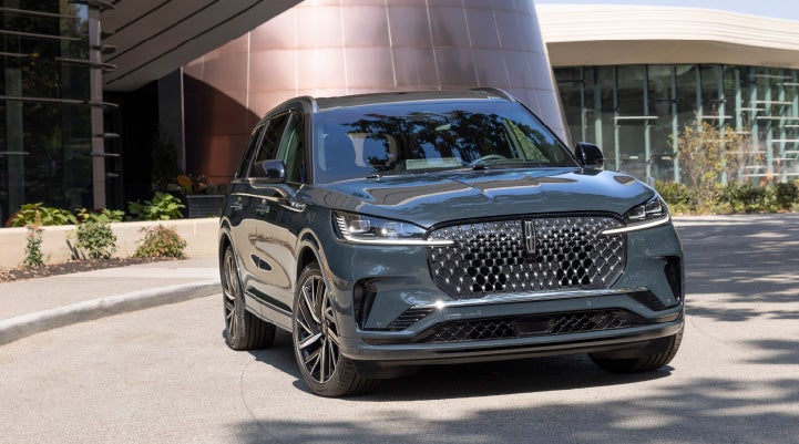 Lincoln Aviator Black Label parked outside next to a red building